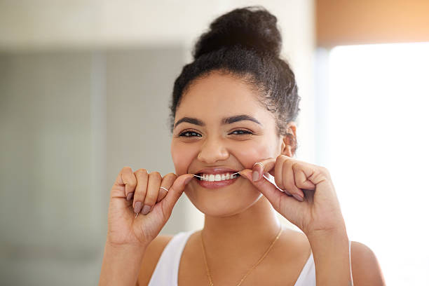 woman using floss