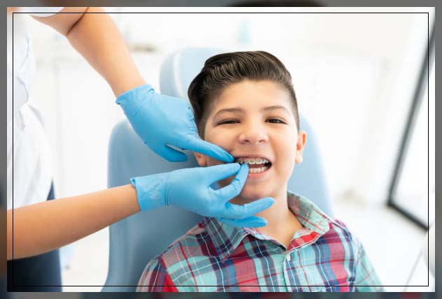 child getting teeth braces
