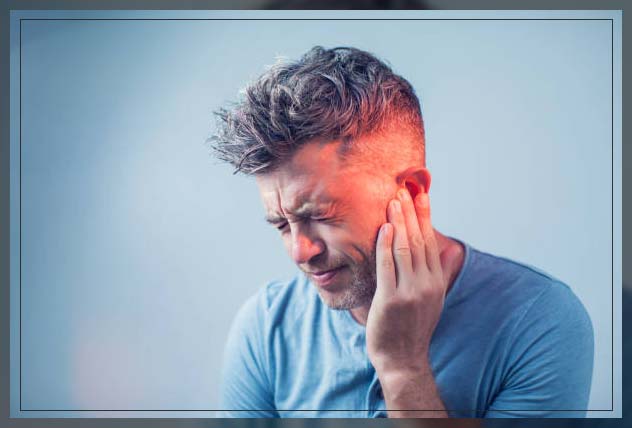 man in pain at risk of tinnitus 