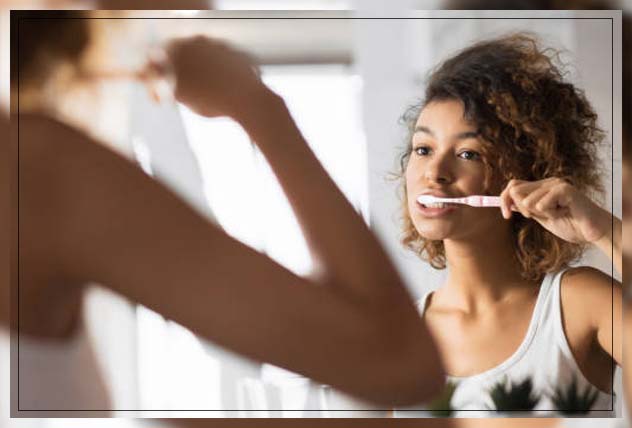 woman brushing teeth slowly