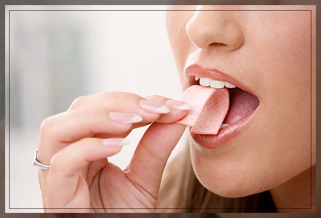 woman chewing gum to increase saliva