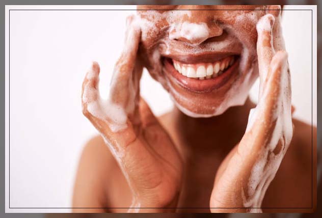 woman cleansing face for clear skin