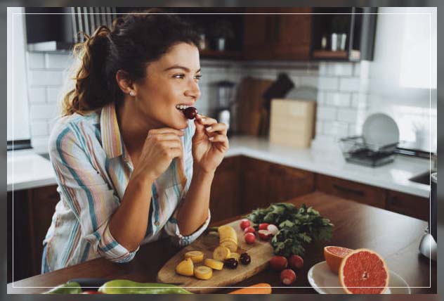 woman eating healthy diet of fruits