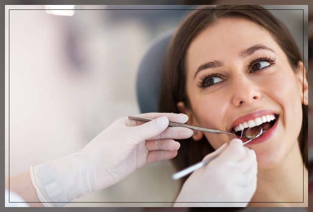 woman visiting dentist to check oral health