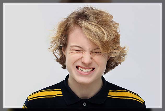 teenage boy with teeth grinding