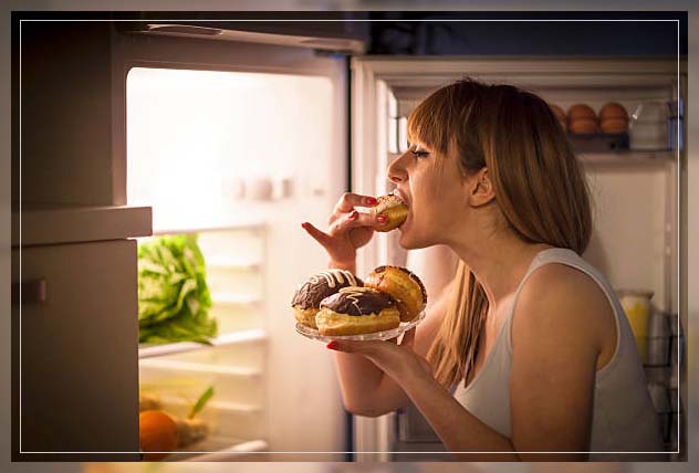 woman indulging in sugary donuts because of eating disorder