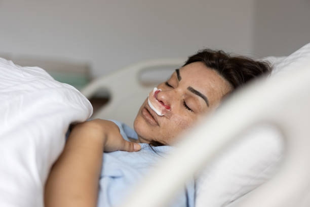 woman lying under anesthesia after procedure