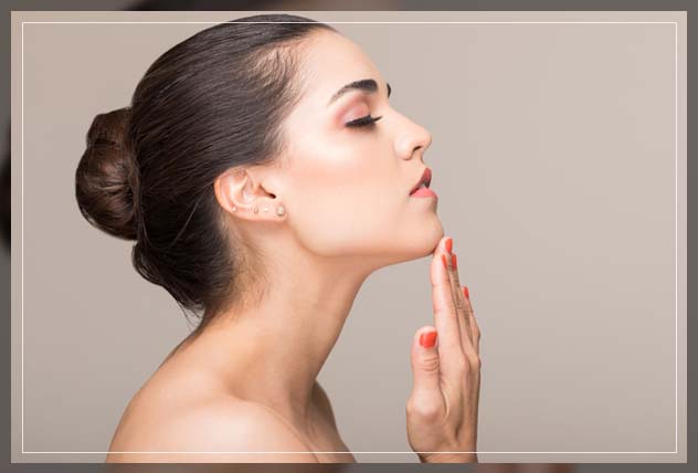 woman touching her chin because of discomfort