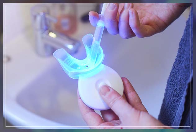 inserting gel in mouth tray