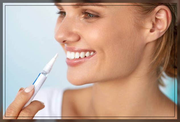 girl applying teeth whitening pen